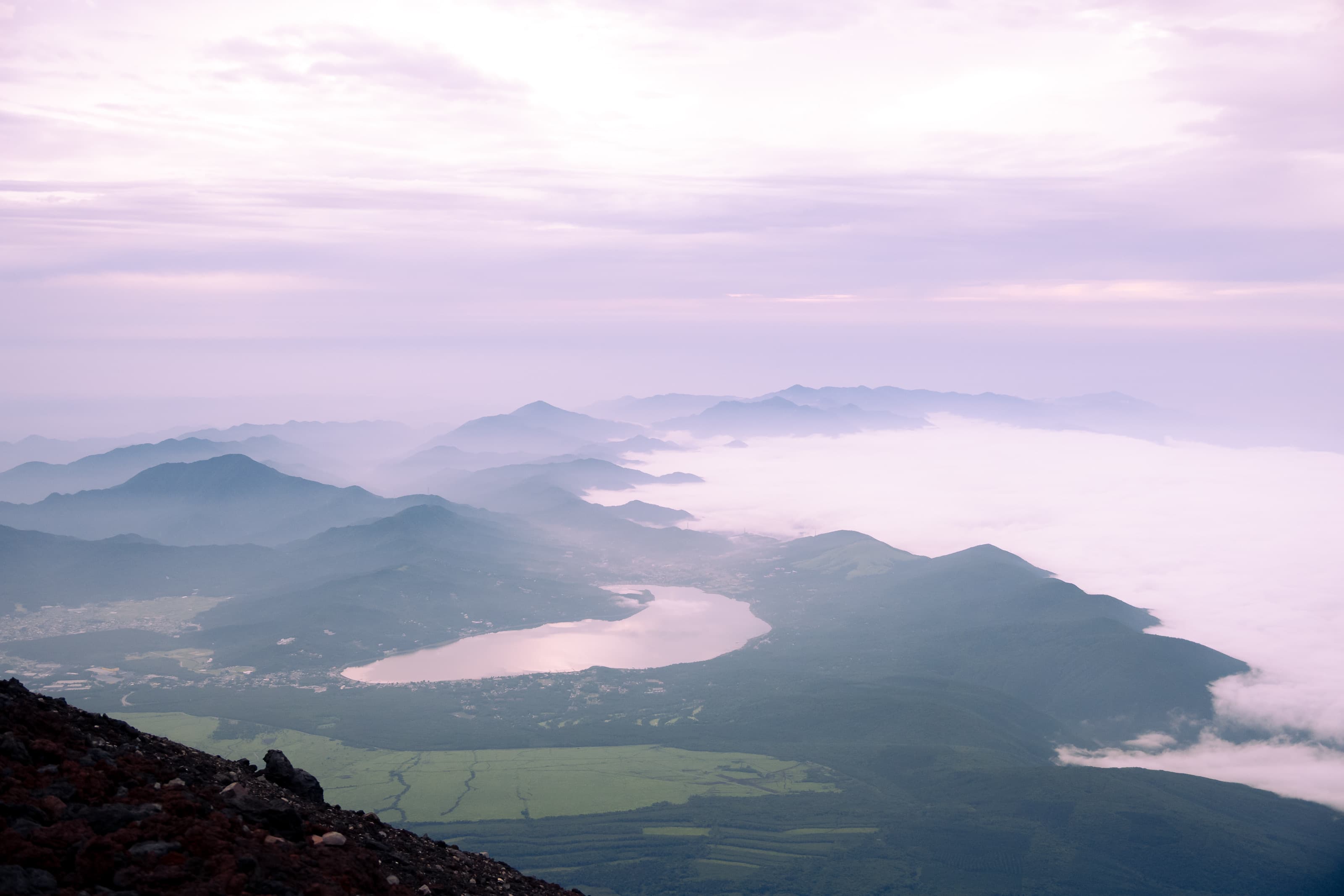 A lake and mountain ranges viewed from a summit